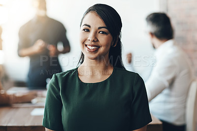 Buy stock photo Cropped portrait of a young businesswoman sitting in the boardroom during a presentation