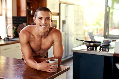 Buy stock photo Cropped shot of a handsome young shirtless man drinking a cup of coffee in the kitchen at home