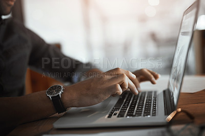 Buy stock photo Closeup shot of an unrecognizable businessman using a laptop in an office