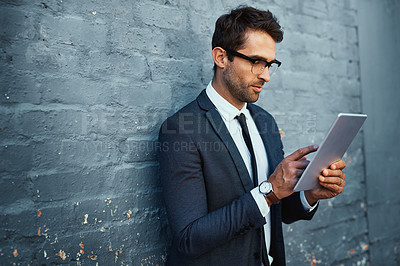 Buy stock photo Tablet, businessman and scrolling with confidence, pride and suit as accountant finance agency. Male person, financial consultant and professional in commercial industry with technology on gray wall
