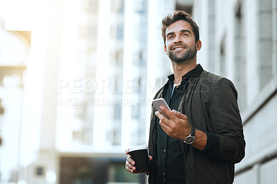 Buy stock photo Cropped shot of a handsome young man sending a text while traveling through the city