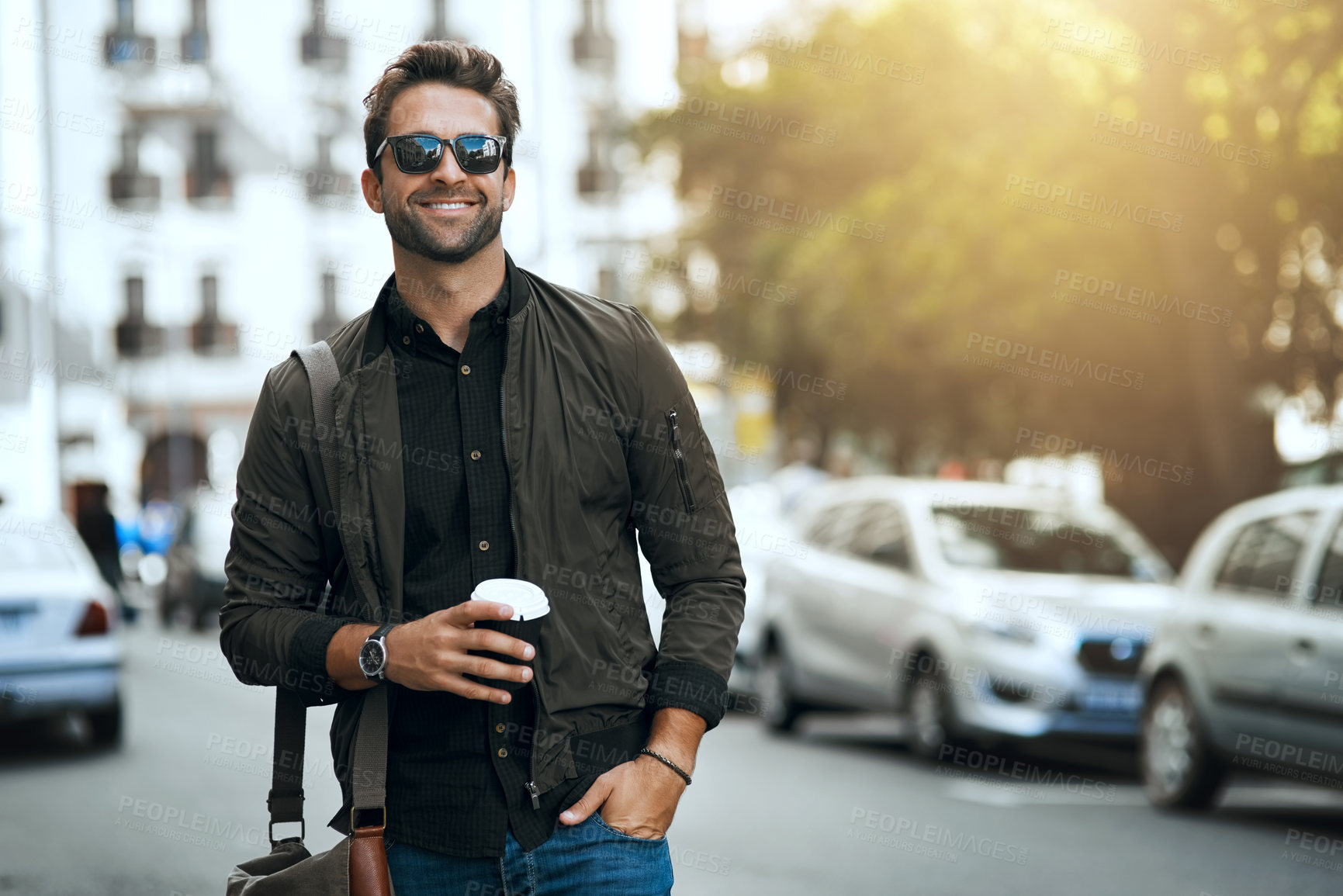 Buy stock photo Cropped shot of a handsome young man traveling through the city