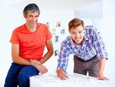 Buy stock photo Portrait of two photographers smiling and looking at you