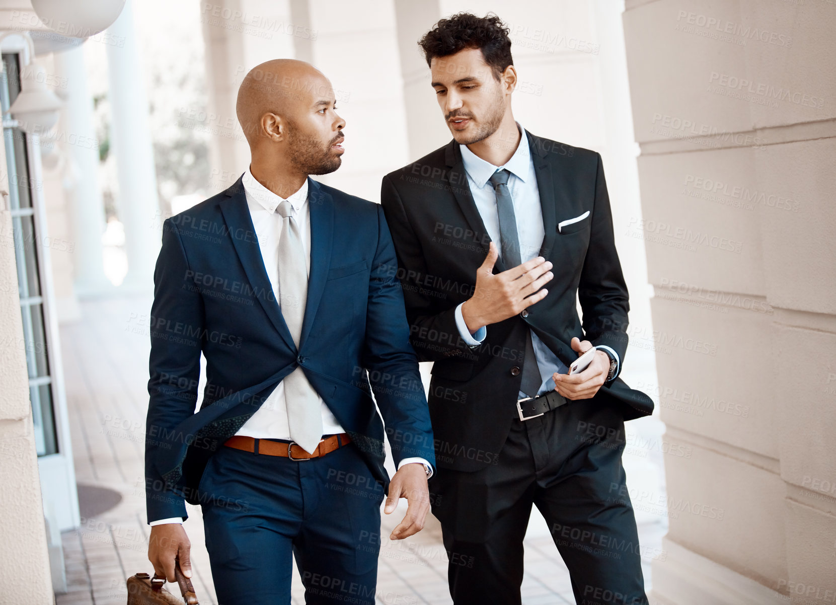 Buy stock photo Cropped shot of young handsome businessmen talking outside