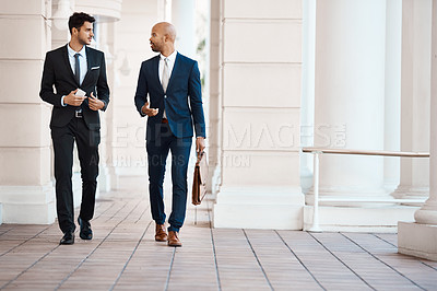 Buy stock photo Shot of young handsome businessmen talking outside