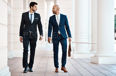 Buy stock photo Shot of young handsome businessmen talking outside