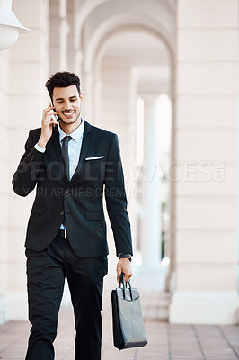 Buy stock photo Cropped shot of a young handsome businessman on a call outside