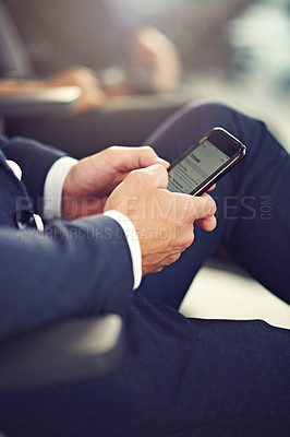 Buy stock photo Closeup shot of an unrecognizable businessman using a cellphone while attending a seminar