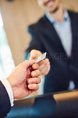 Buy stock photo Cropped shot of unrecognizable businessman checking into a hotel