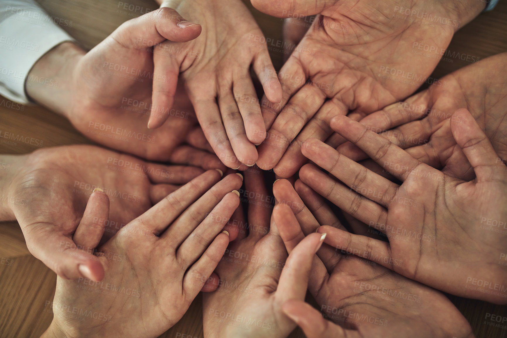 Buy stock photo Cropped shot of a group of businesspeople with their hands opened