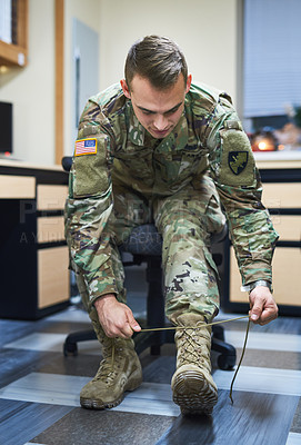 Buy stock photo Soldier, man and tie shoelaces with boots, ready or clothes for Independence Day parade for pride. Army officer, veteran and camouflage uniform at USA military base, march and celebration of freedom