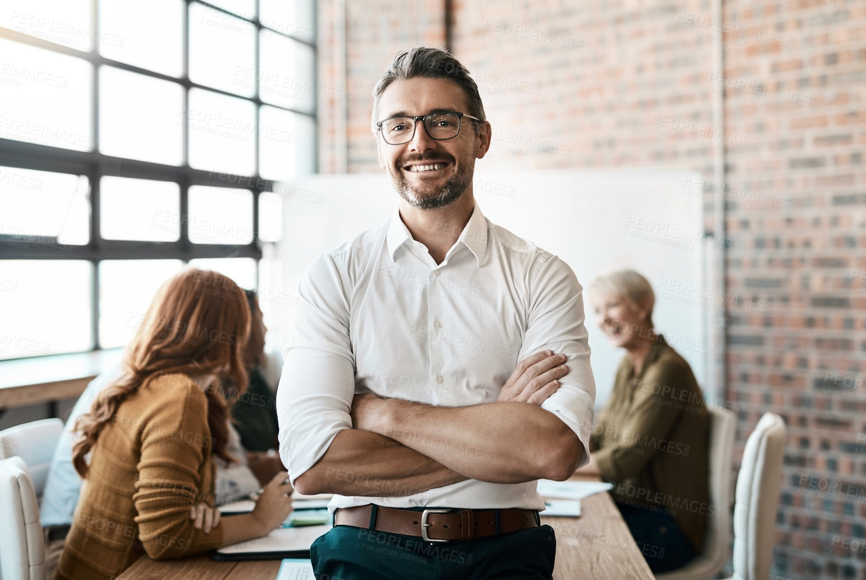Buy stock photo Portrait, smile and man with startup, arms crossed and teamwork with confidence, workplace and happiness. Face, male CEO and leader in a workshop, meeting and collaboration for brainstorming