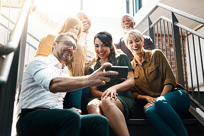 Buy stock photo Group, people and stairs with smile or phone, diversity and lens flare in office. Crowd, international and happiness with mobile technology for company profile picture, team building for employees