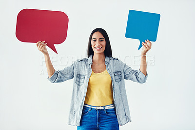 Buy stock photo Studio shot of an attractive young woman holding speech bubbles