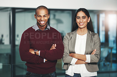 Buy stock photo Portrait of two young businesspeople standing together in an office