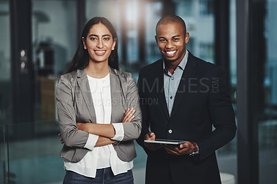 Buy stock photo Portrait of two young businesspeople standing together in an office