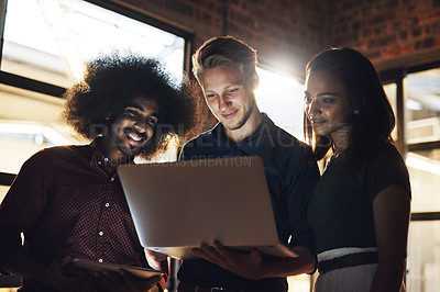 Buy stock photo Colleagues, group and smile for reading, laptop and brainstorming in workspace and teamwork. Workplace, men and woman in office, planning and collaboration of project, auditor or startup of business