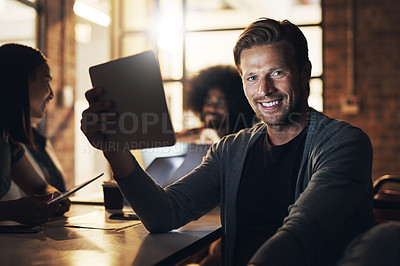 Buy stock photo Cropped portrait of a handsome young male designer sitting in the boardroom during a meeting