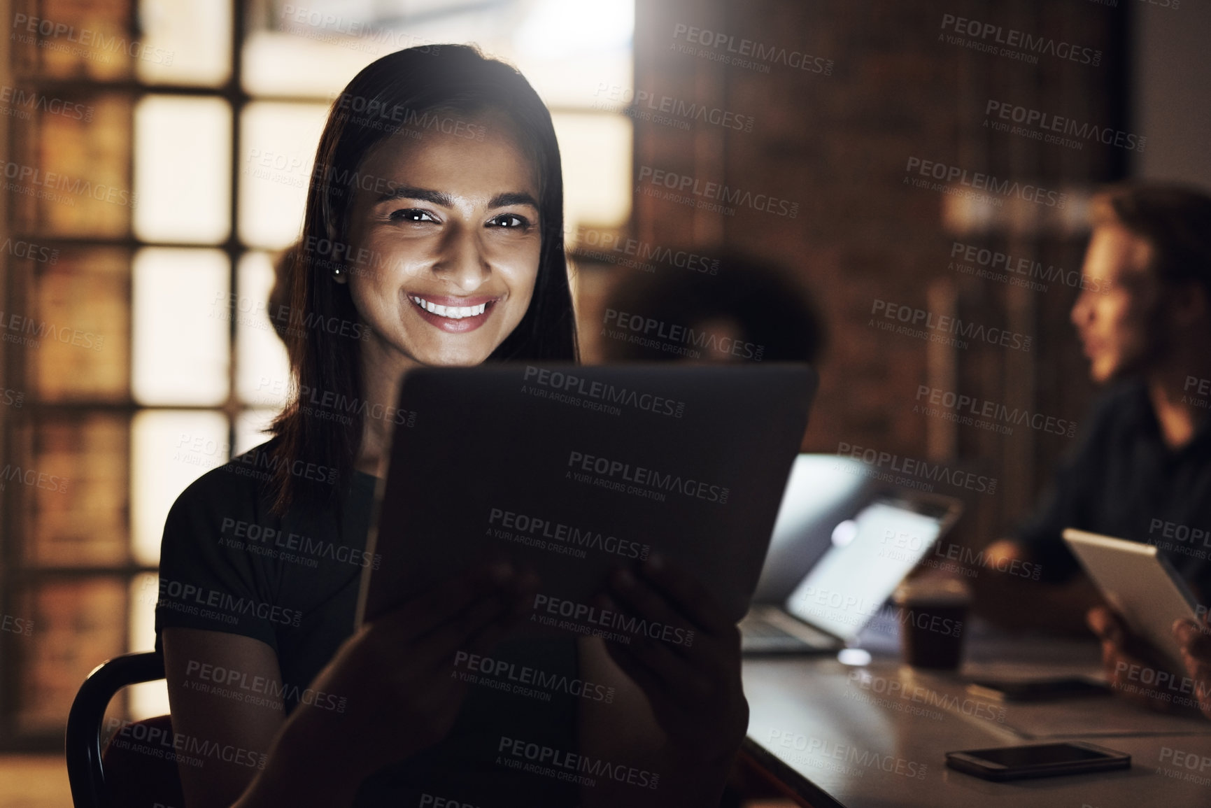 Buy stock photo Cropped portrait of an attractive young female designer sitting in the boardroom during a meeting