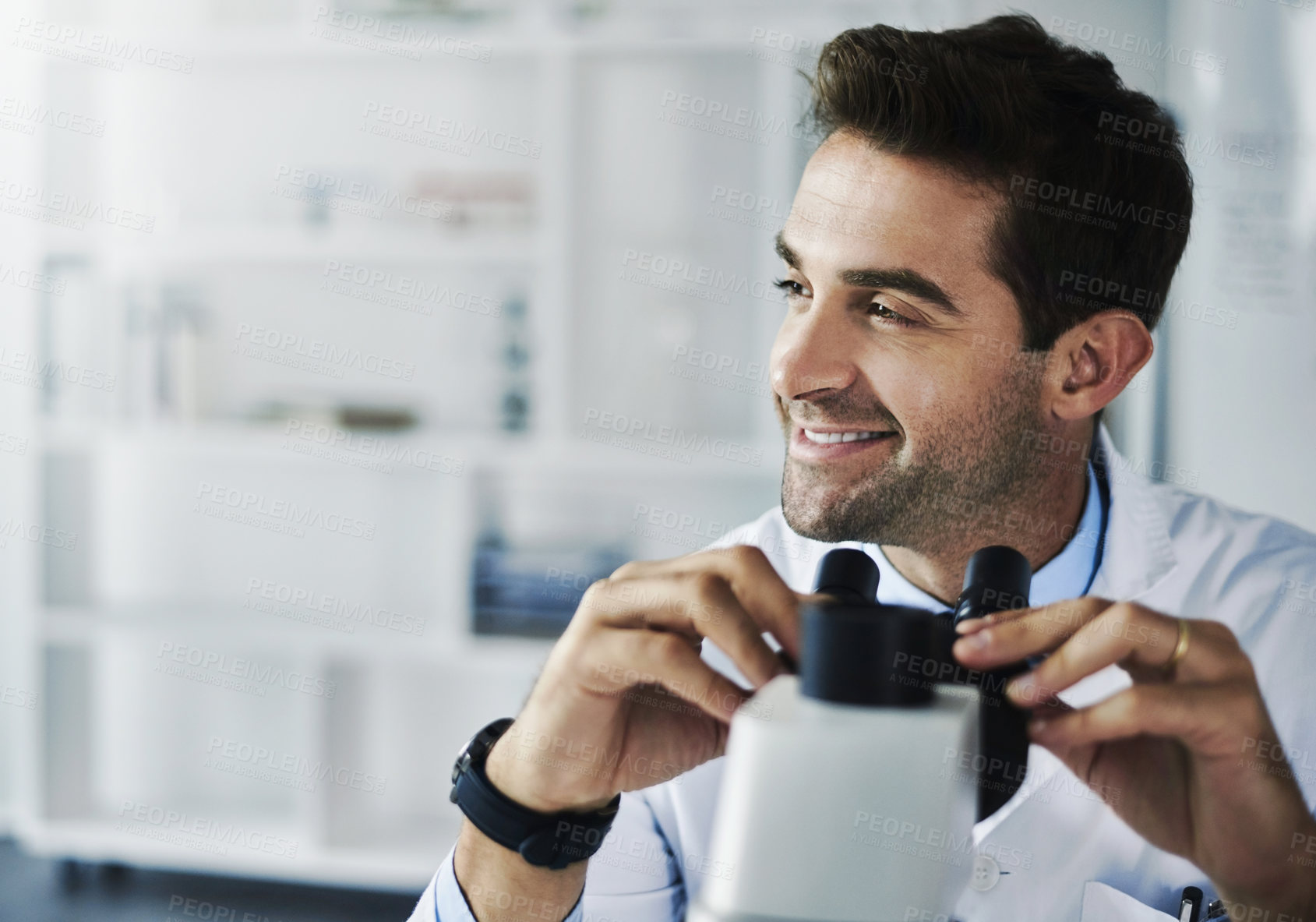 Buy stock photo Shot of a scientist using a microscope in a lab