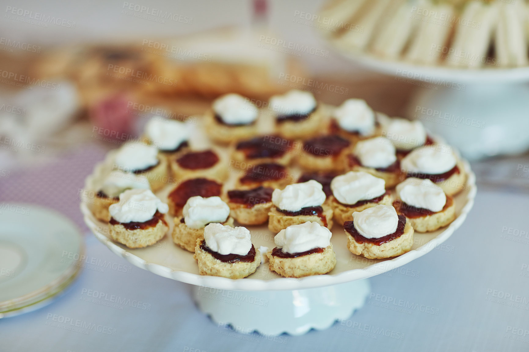 Buy stock photo Shot of yummy scones on a table at a tea party inside