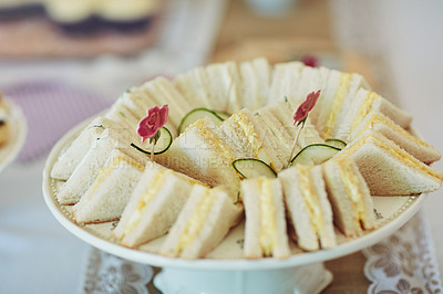 Buy stock photo Shot of triangular sandwiches on a table at a tea party inside