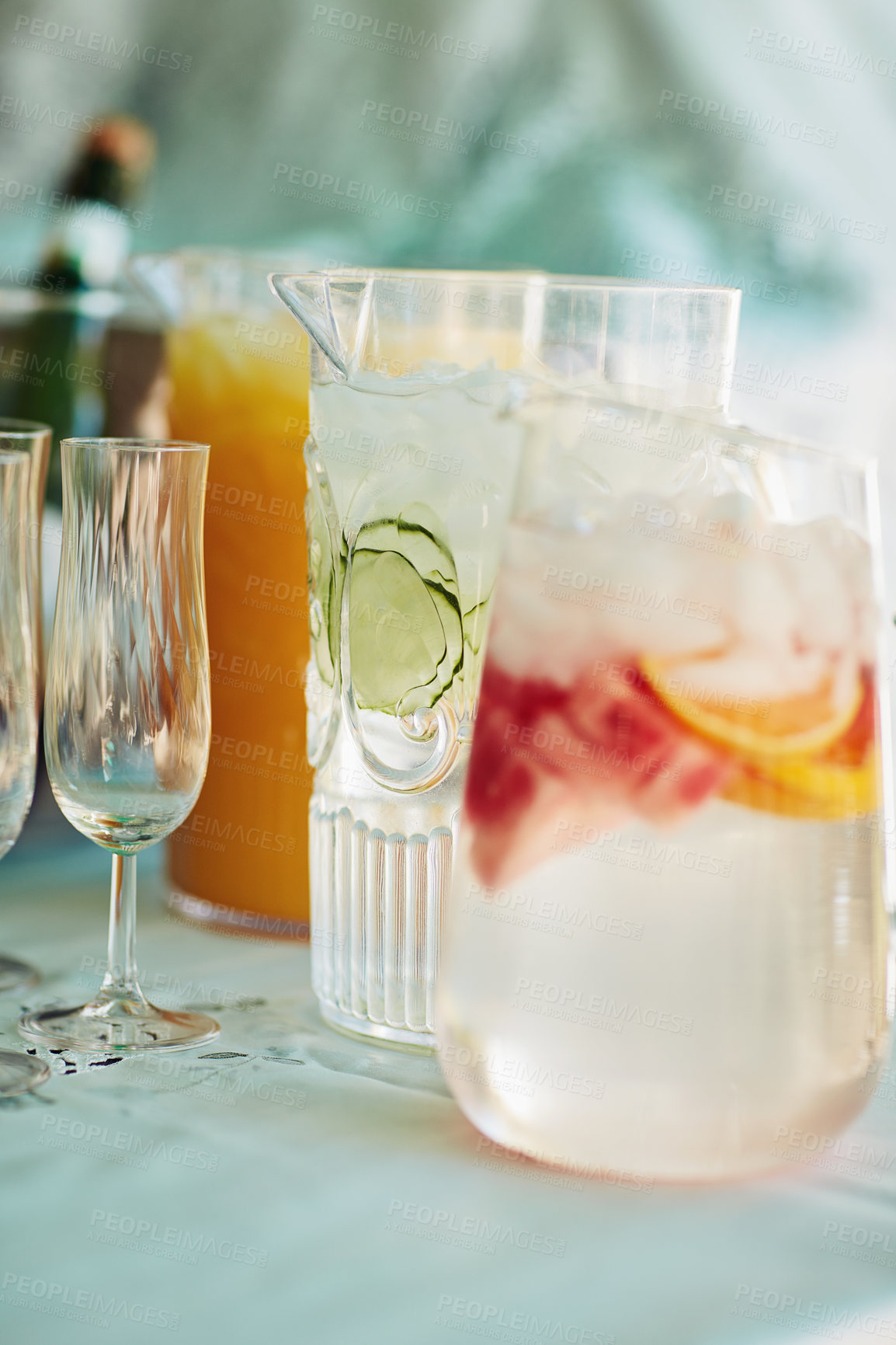 Buy stock photo Jug, fruit water and home for beverage hydration, nutrition and table setup for celebration. Drink, glass and decoration and special event for festive arrangement, holiday catering and detox liquid