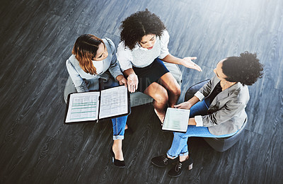 Buy stock photo High angle shot of a group of businesswomen having a discussion in an office