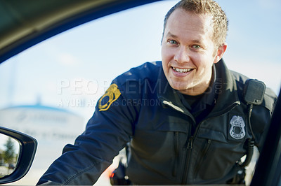 Buy stock photo Cropped portrait of a handsome young male traffic officer working at a roadblock