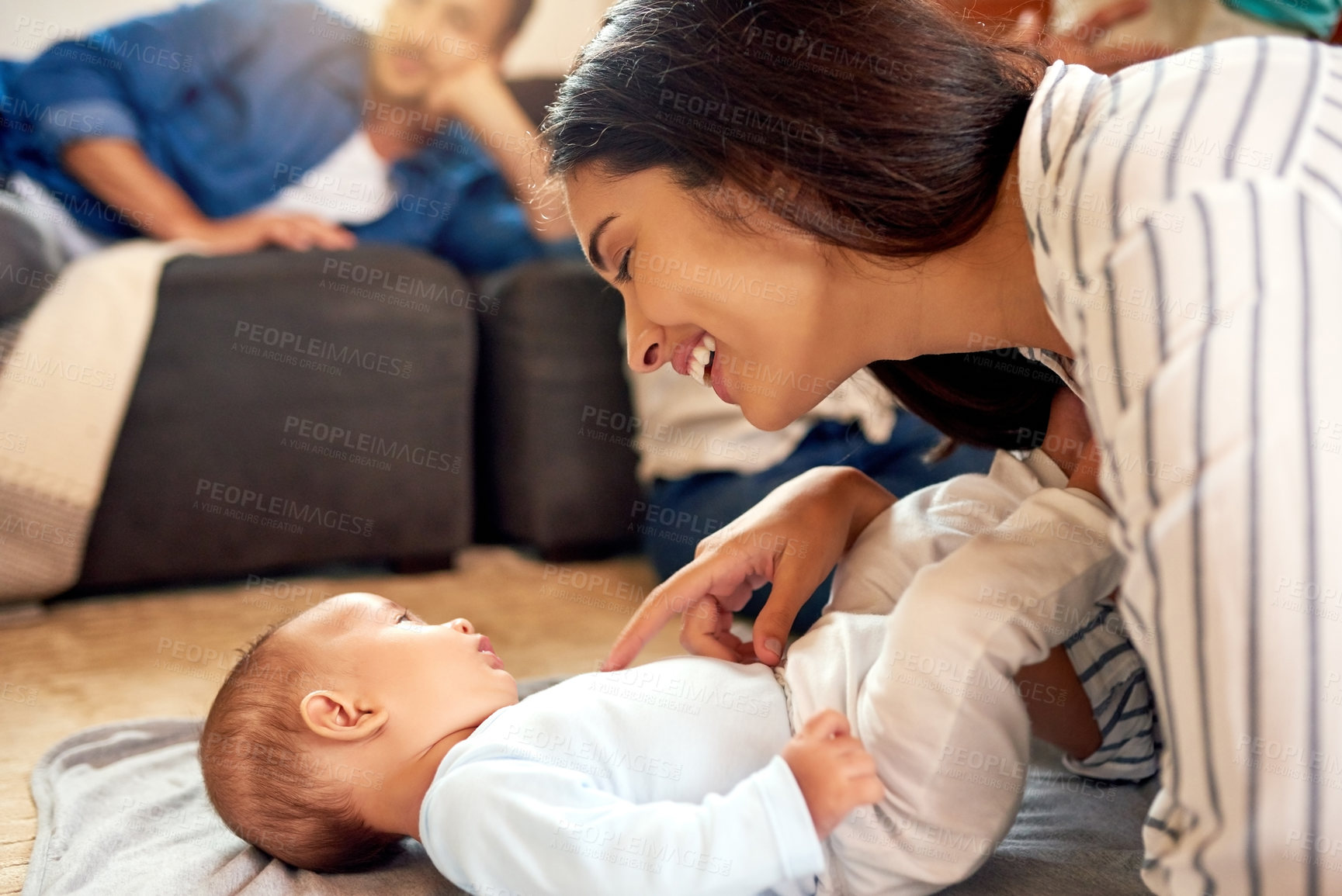 Buy stock photo Happy, tickling and mother with baby in home for bonding, family time and connection with love. Relax, laughing and mom playing with newborn, infant and child on floor in living room at house.