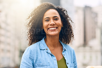 Buy stock photo Shot of an attractive young woman out and about in the city