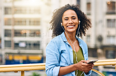 Buy stock photo Phone, music and portrait of woman in city with happiness listening to track, audio and song in urban town. Traveling, happy and African female person streaming radio for relaxing, chill and peace
