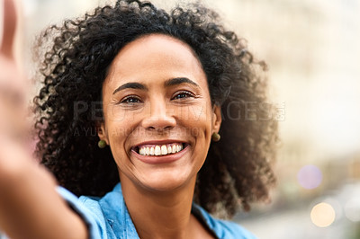 Buy stock photo Shot of a young woman out and about in the city