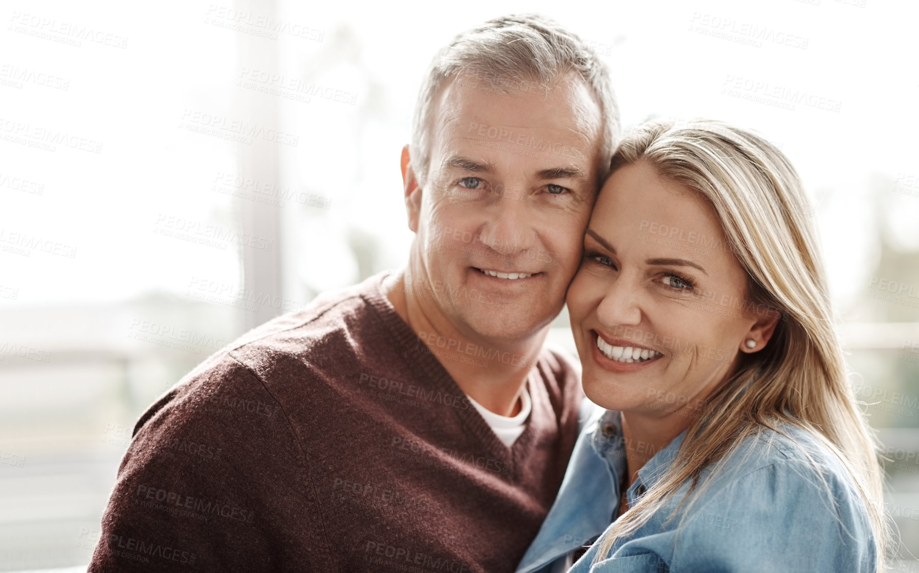 Buy stock photo Portrait of a happy mature couple at home