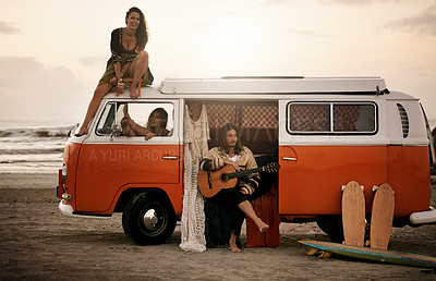 Buy stock photo Shot of an adventurous group of young people out roadtripping in their mini van