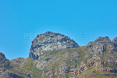 Buy stock photo Scenic landscape of Twelve Apostles mountain under clear blue sky copy space in Cape Town, South Africa. Famous travel and tourism destination with steep hiking terrain and growing trees and bushes
