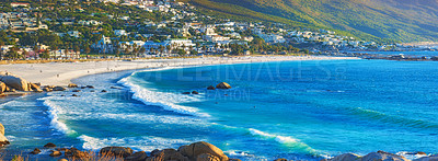 Buy stock photo Ocean view of Camps Bay, Table Mountain National Park, Cape Town, South Africa. Panorama seascape boulders and rocks in the ocean and sea waves washing onto a rocky shore. Popular tourism beach