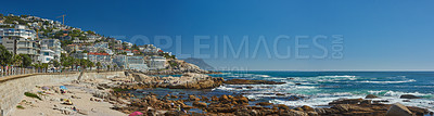 Buy stock photo Landscape of Clifton Beach with a blue sky and copy space in Cape Town, South Africa. Luxury accommodation and holiday apartment buildings with scenic ocean views. Popular tourism summer destination