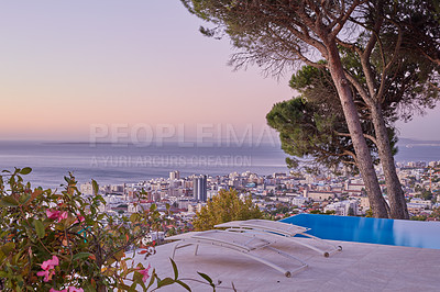 Buy stock photo Aerial view of sea point, Cape Town during sunset. The beautiful landscape panorama of South Africa with copy space and sea horizon touching the sky. Scenic view of a town with skyscrapers and trees