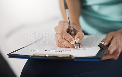 Buy stock photo Cropped shot of an unrecognizable female physiotherapist working in her office