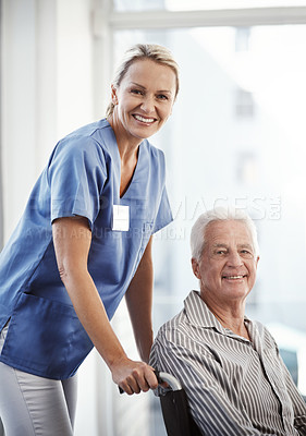 Buy stock photo Cropped portrait of a mature female nurse and her senior male wheelchair-bound patient in the hospital