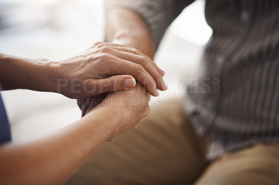 Buy stock photo Cropped shot of two unrecognizable people holding hands in comfort