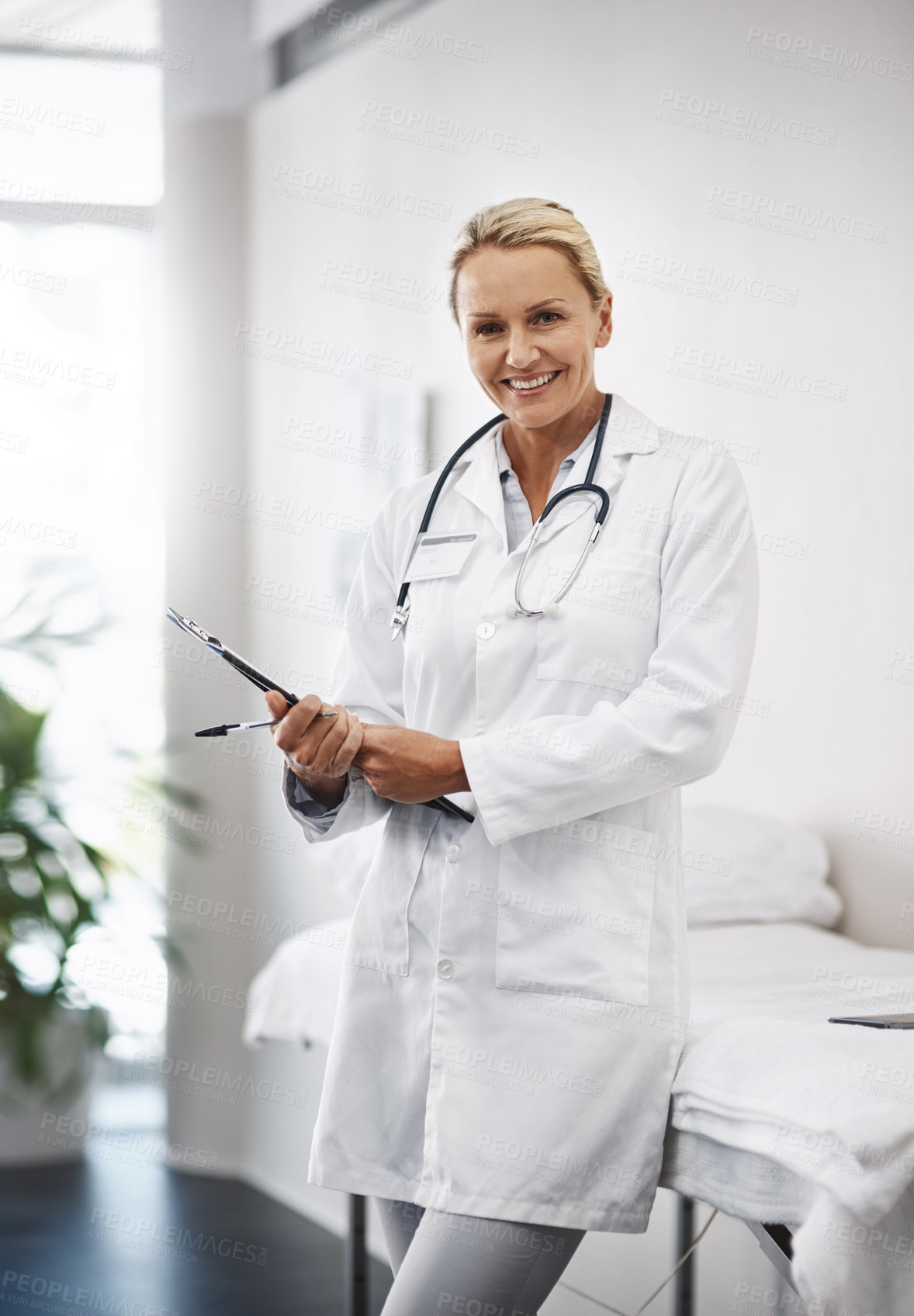 Buy stock photo Woman, doctor or portrait for healthcare with checklist, admin or notes in hospital. Mature cardiologist, smile or paper in practice for client information, session preparation or registration forms