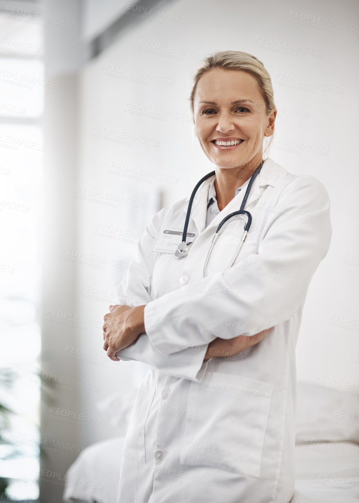 Buy stock photo Cropped portrait of a mature female doctor working in her office in the hospital