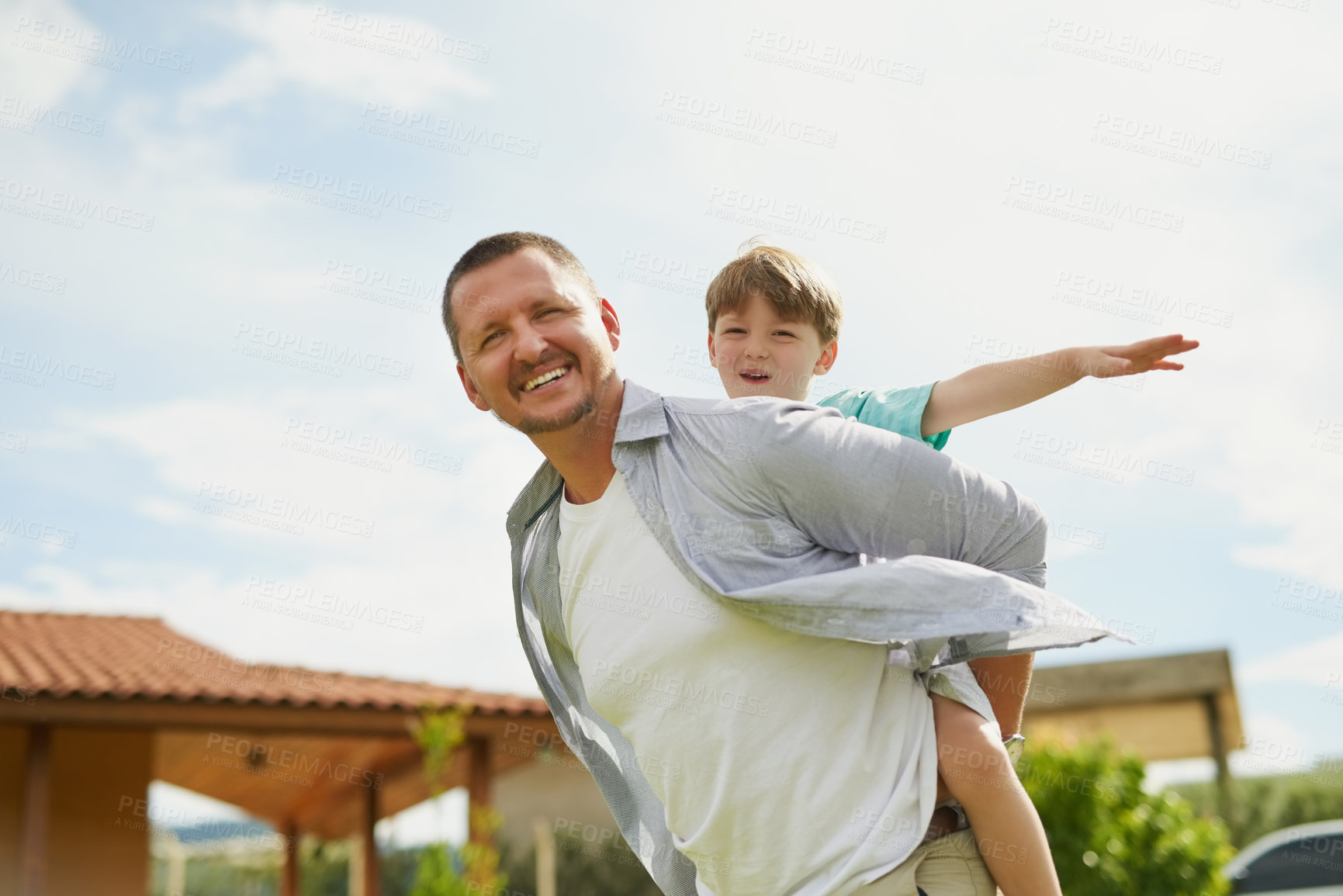 Buy stock photo Father, boy and piggyback portrait in backyard, love and bonding to connect in childhood at home. Daddy, carrying son and adventure game for airplane flying in outdoor, happiness and care or support