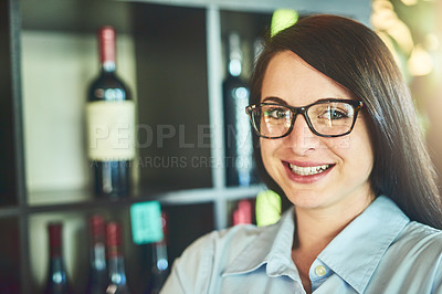Buy stock photo Portrait of a young sommelier in a wine cellar