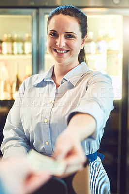 Buy stock photo Portrait of a young woman receiving payment from a customer in a cafe