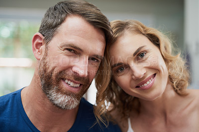 Buy stock photo Portrait of a happy middle aged couple spending time together at home