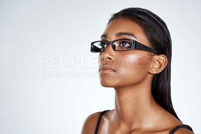 Buy stock photo Indian woman, optometry and glasses with thinking in studio on white background for prescription, healthcare and vision. Female person, confident and specs or frame lens for eyesight, future and idea