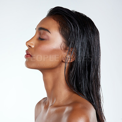 Buy stock photo Studio shot of a beautiful young woman posing against a light background